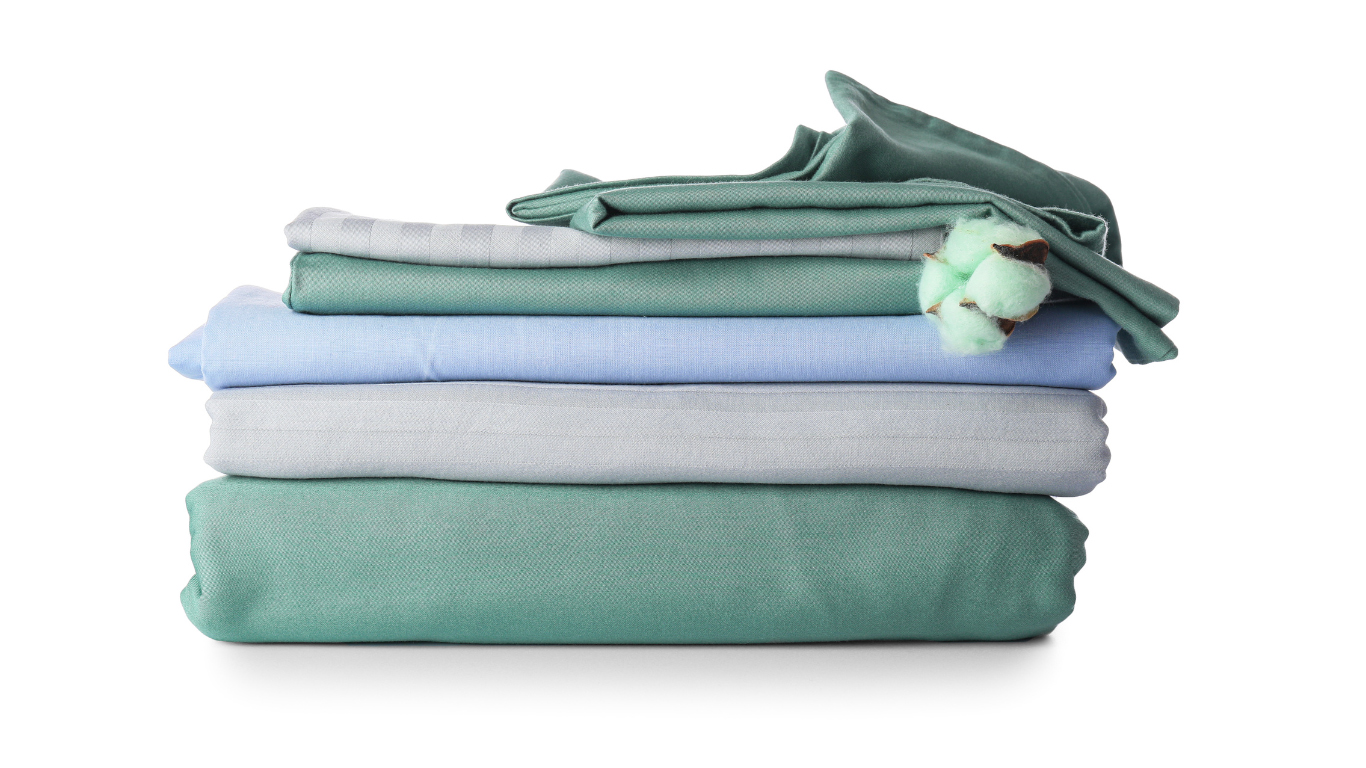 AJM hospital bed linen including bed sheets, duvet covers, and protectors designed for hygiene, comfort, and clinical use in hospitals and recovery rooms.